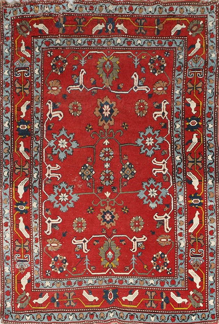 Appraisal: AN ANTIQUE CAUCASIAN TRIBAL RUG with interlinked star motifs on