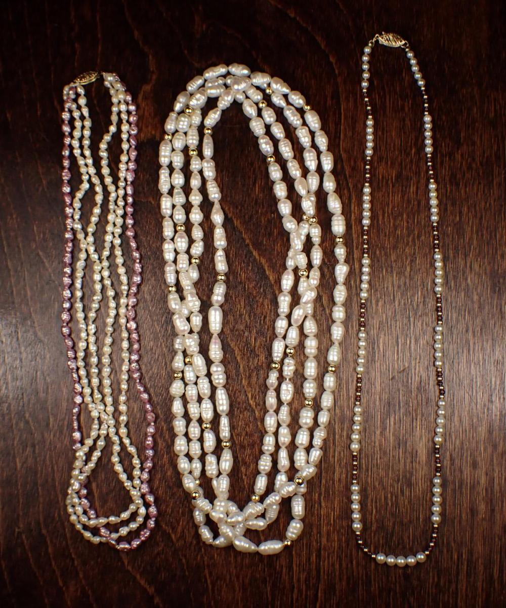 Appraisal: THREE PEARL AND FOURTEEN KARAT GOLD NECKLACES rope length strand