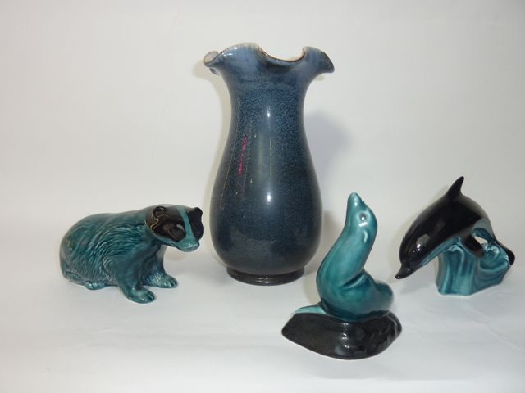 Appraisal: A collection of four pieces of Poole Pottery comprising a