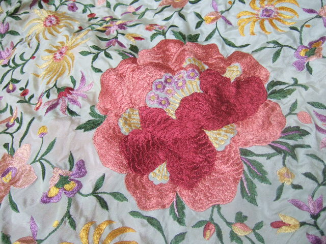 Appraisal: A Chinese tasselled silk shawl s embroidered with peony and