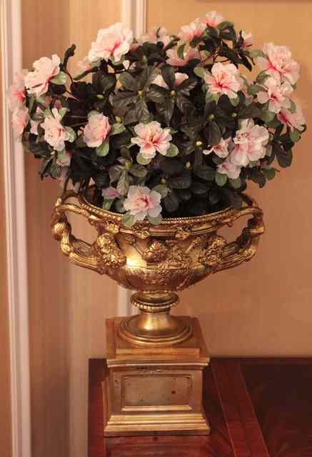 Appraisal: A GILT COMPOSITE SMALL 'WARWICK VASE' on square pedestal base