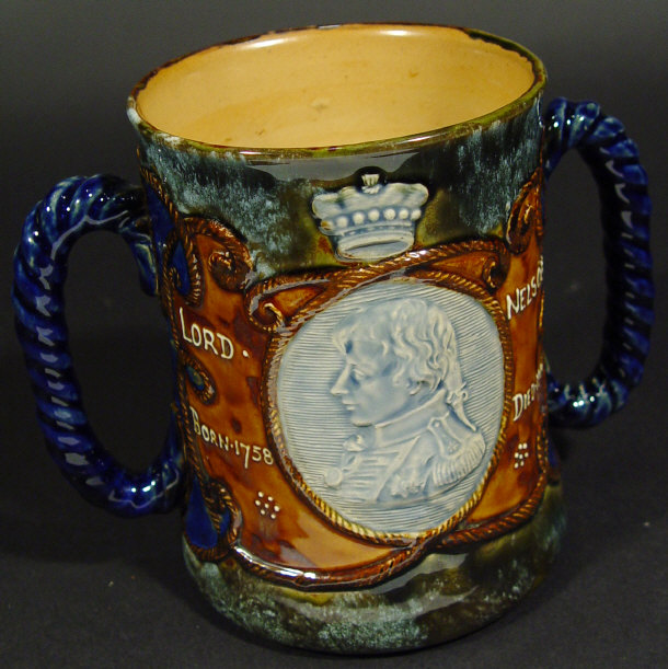 Appraisal: Royal Doulton stoneware loving cup relief moulded with a portrait