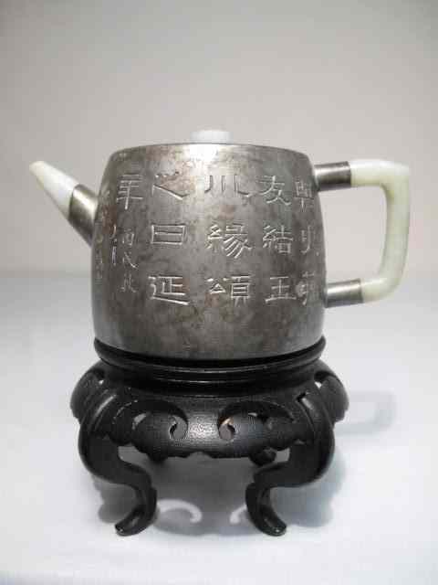 Appraisal: Early Chinese pewter teapot Engraved with symbols and characters on