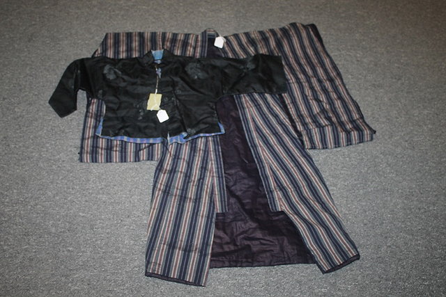 Appraisal: A CHINESE CHILD'S BLACK TUNIC circa and a Japanese blue