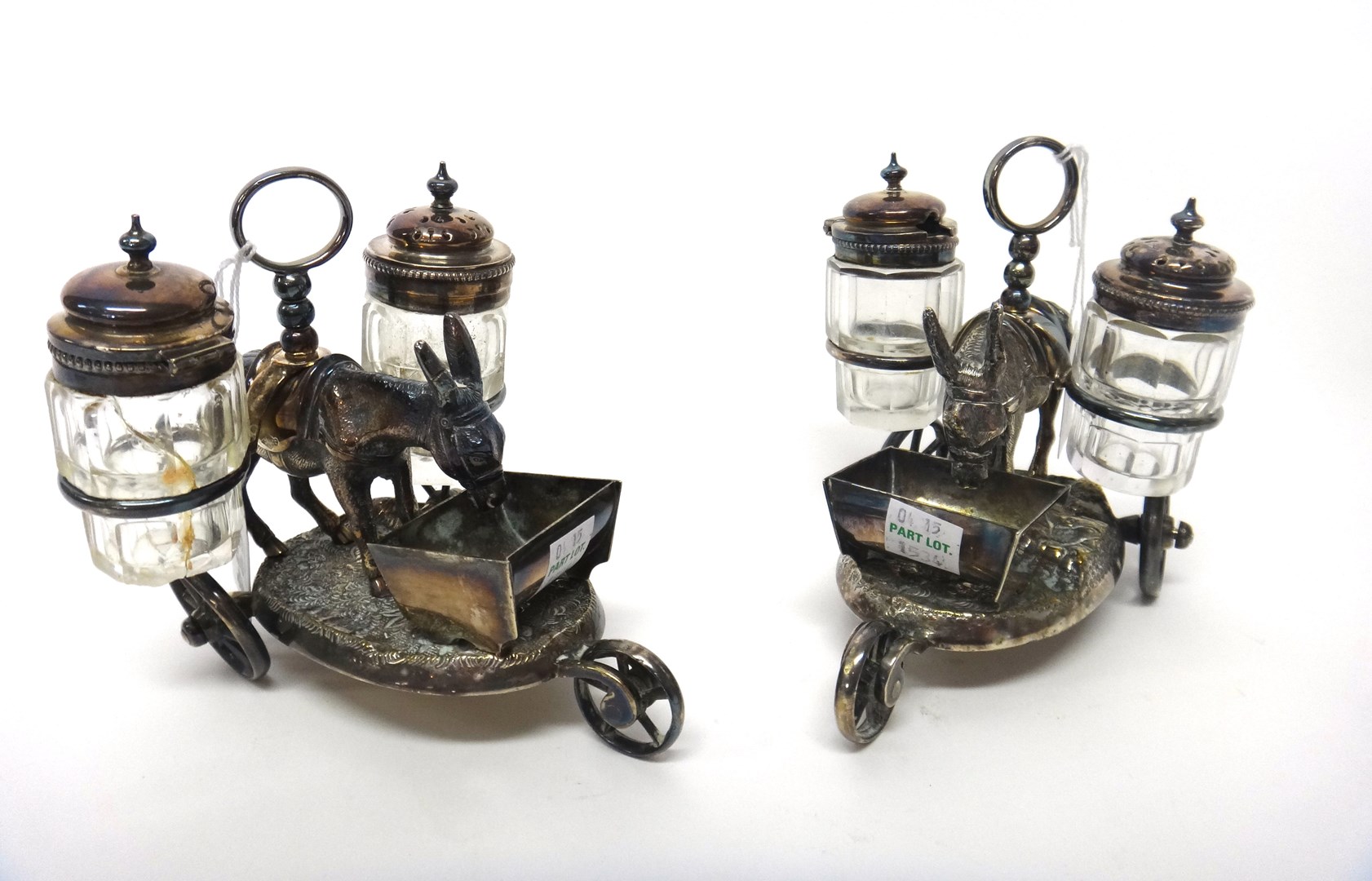 Appraisal: A pair of plated novelty cruets each formed as a