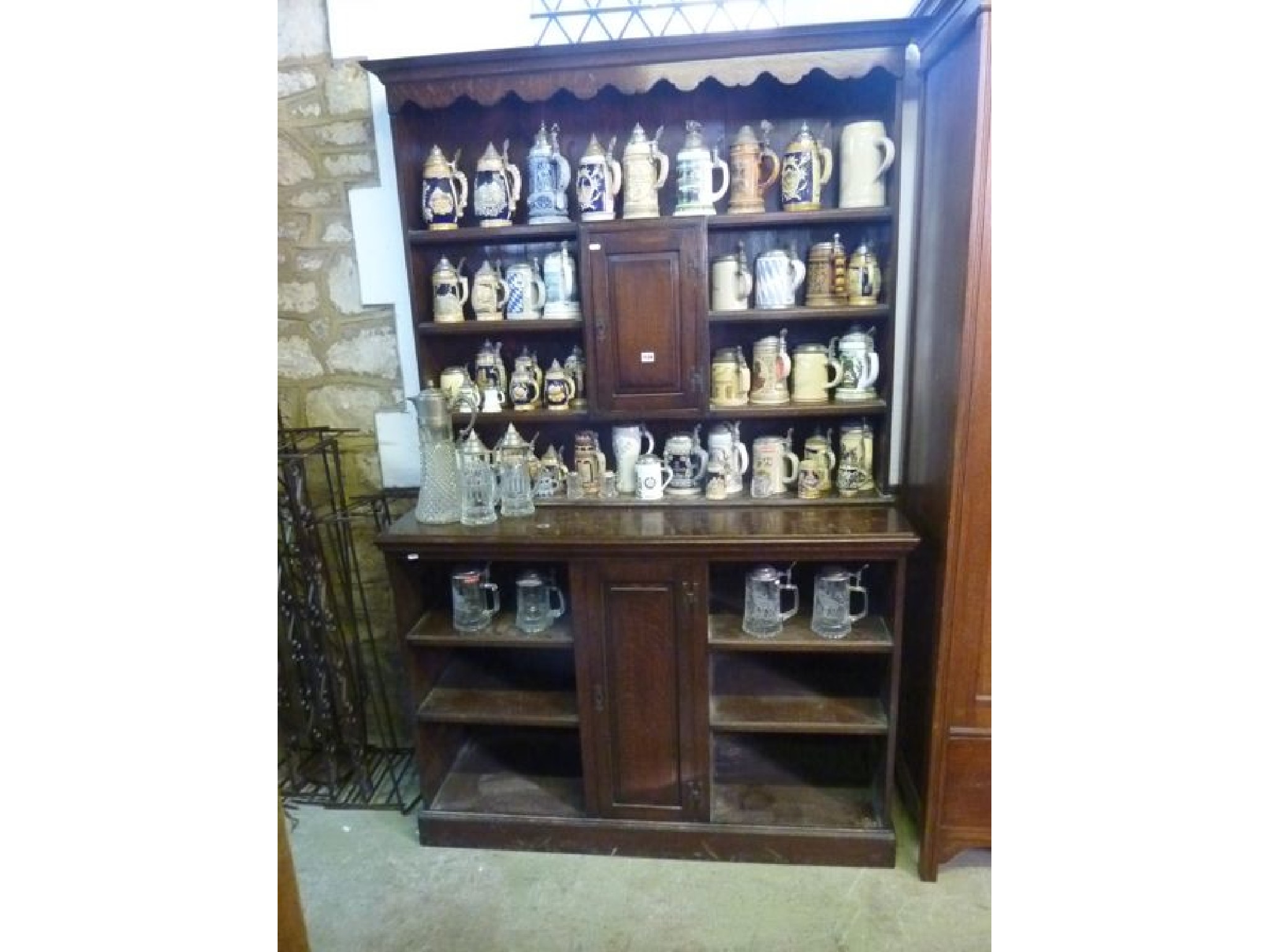 Appraisal: An early th century oak dresser the lower part enclosed