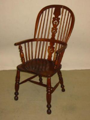 Appraisal: AN ASH AND ELM WINDSOR ARMCHAIR of high hoop back