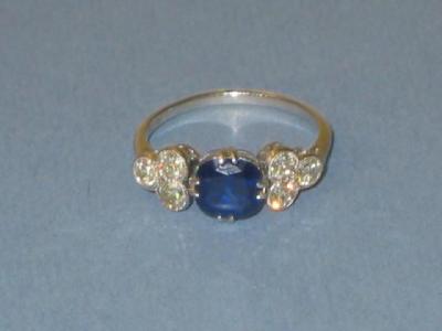 Appraisal: A SAPPHIRE AND DIAMOND RING the deep blue cushion cut