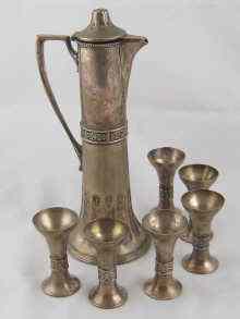 Appraisal: An Argentor silver plated tall spirit decanter with six matching