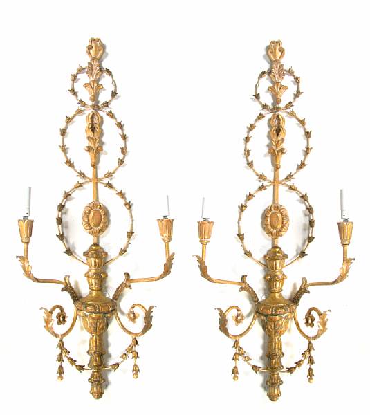 Appraisal: A pair of Neoclassical style giltwood wall sconces height in