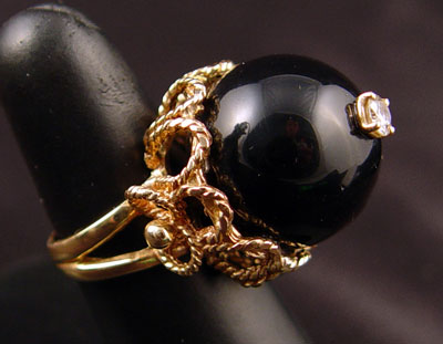 Appraisal: K ONYX BALL CT DIAMOND RING K yellow gold mm