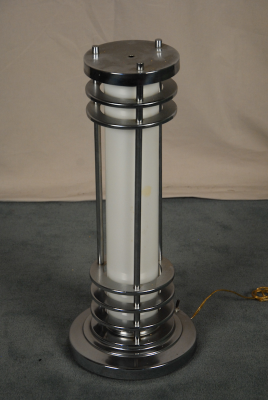 Appraisal: A Cylindrical Chrome Table Lamp horizontal bars stepped round base