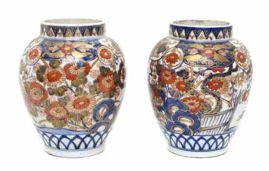 Appraisal: A Pair of Japanese Imari Vases of tapering baluster form