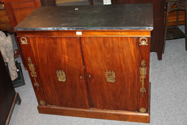 Appraisal: A FRENCH EMPIRE MAHOGANY SIDE CUPBOARD enclosed by two panel