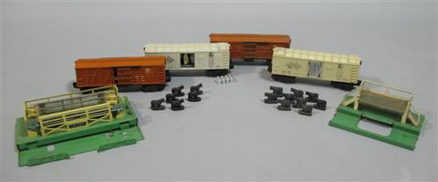 Appraisal: LIONEL MODEL TRAINS POSTWAR MILK AND CATTLE CARS Lionel Model