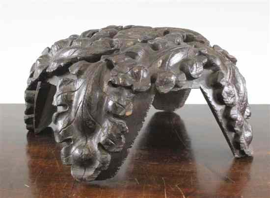 Appraisal: A th century carved oak ceiling boss decorated with oak