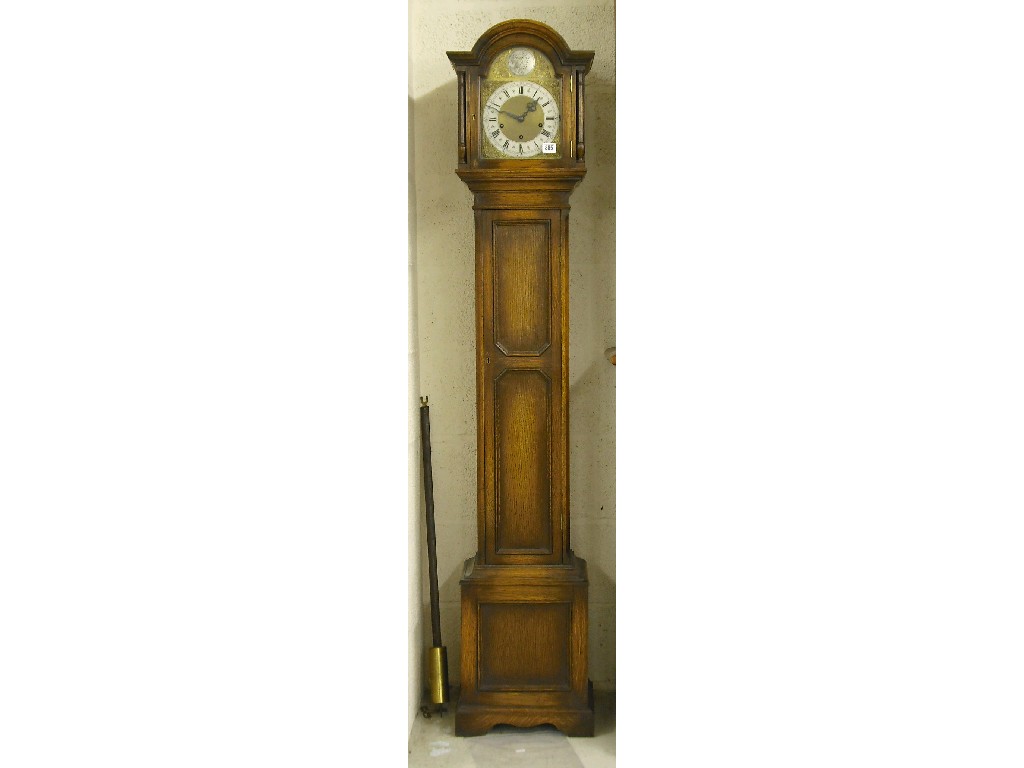 Appraisal: Oak three train grandmother clock the arched brass dial signed