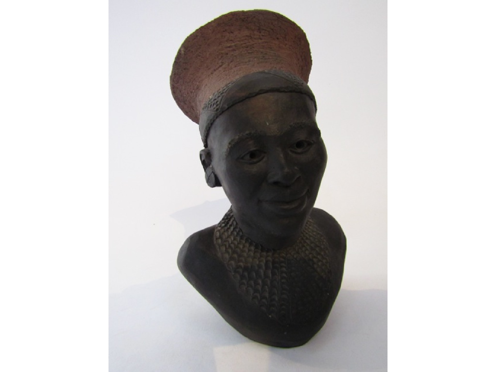 Appraisal: A studio pottery bust of an African male figure in