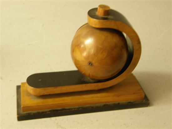 Appraisal: Art Deco applewood and ebonised globe clock on shaped support