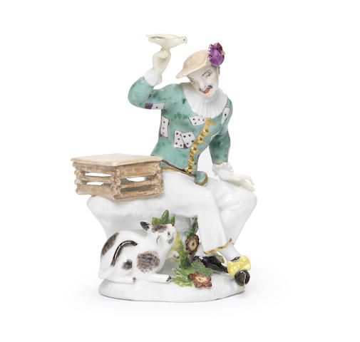 Appraisal: A Meissen figure of Harlequin with a bird and a