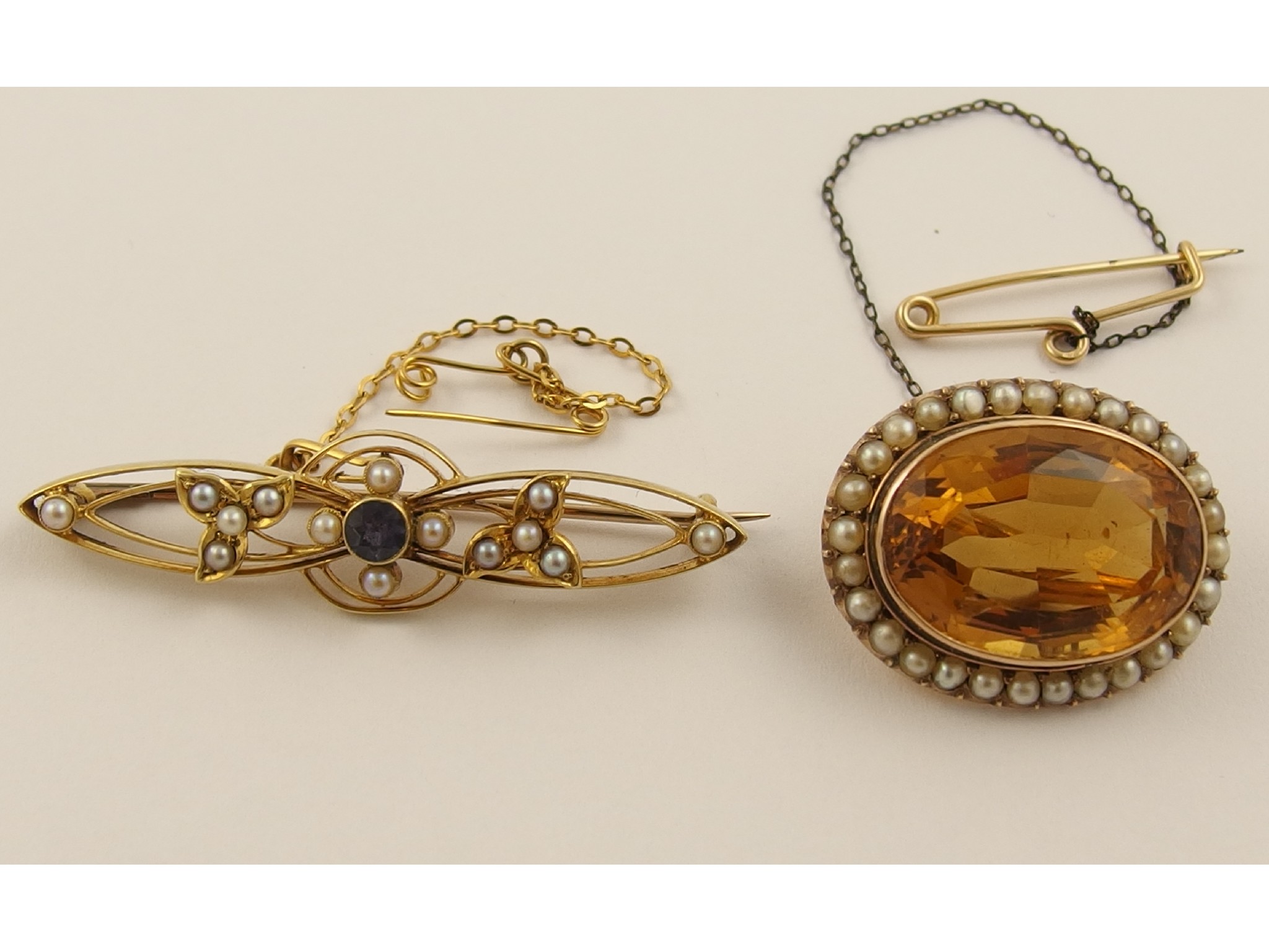 Appraisal: A yellow metal citrine and pearl brooch together with a