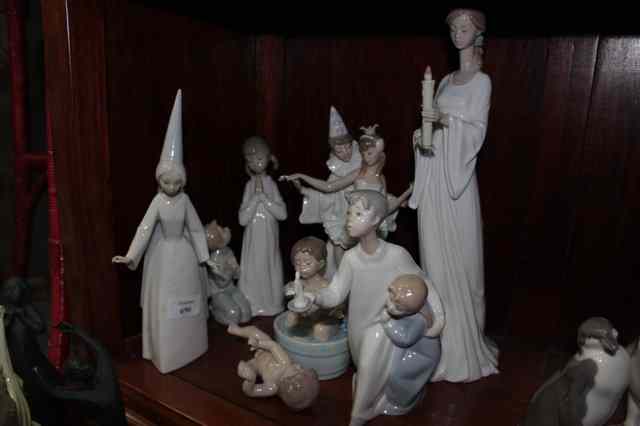 Appraisal: A GROUP OF LLADRO PORCELAIN FIGURES to include a girl