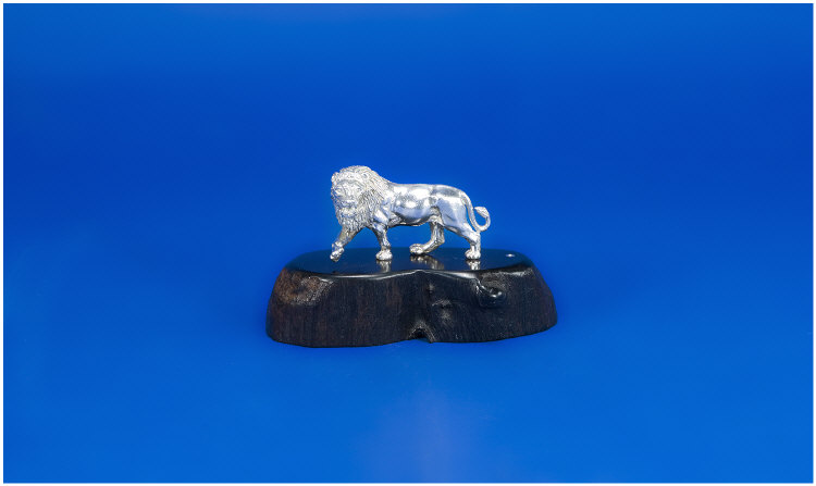 Appraisal: Silver Detailed Model Of A Lion In Standing Pose Snarling