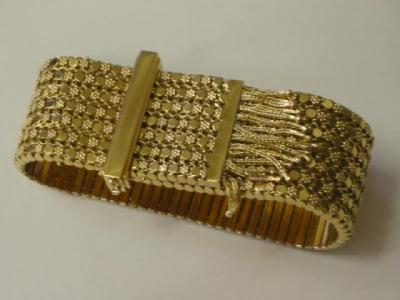 Appraisal: AN CT GOLD BRACELET modelled as a wide belt comprising