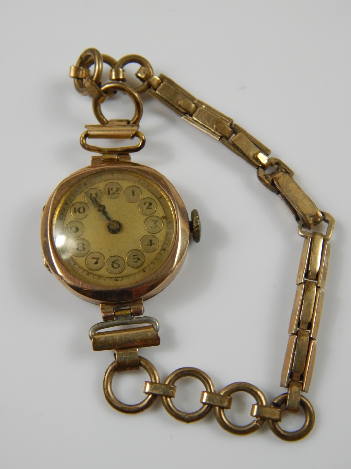 Appraisal: A ladies wristwatch with yellow metal watch head and gold