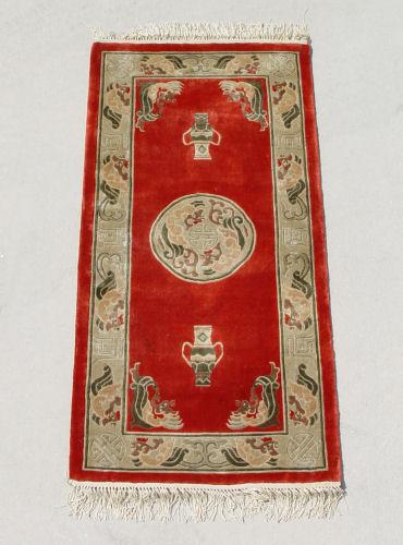 Appraisal: CHINESE RED SILK RUG Central medallion and border on red