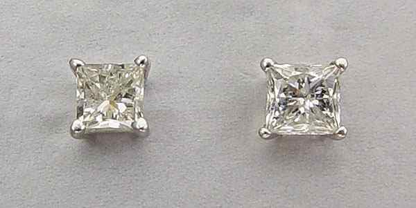 Appraisal: CT PRINCESS DIAMOND EARRINGS K white gold solitaire earrings contain