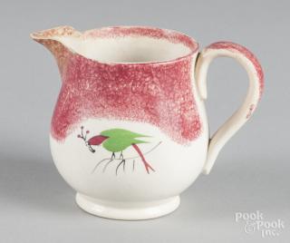 Appraisal: Red spatter creamer with parrot decoration '' h