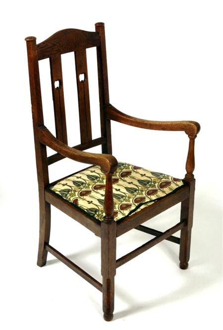 Appraisal: An Arts and Crafts oak high back chair the arched