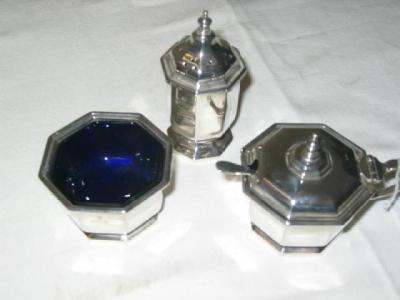 Appraisal: A THREE PIECE CONDIMENT SET of octagonal form with turned