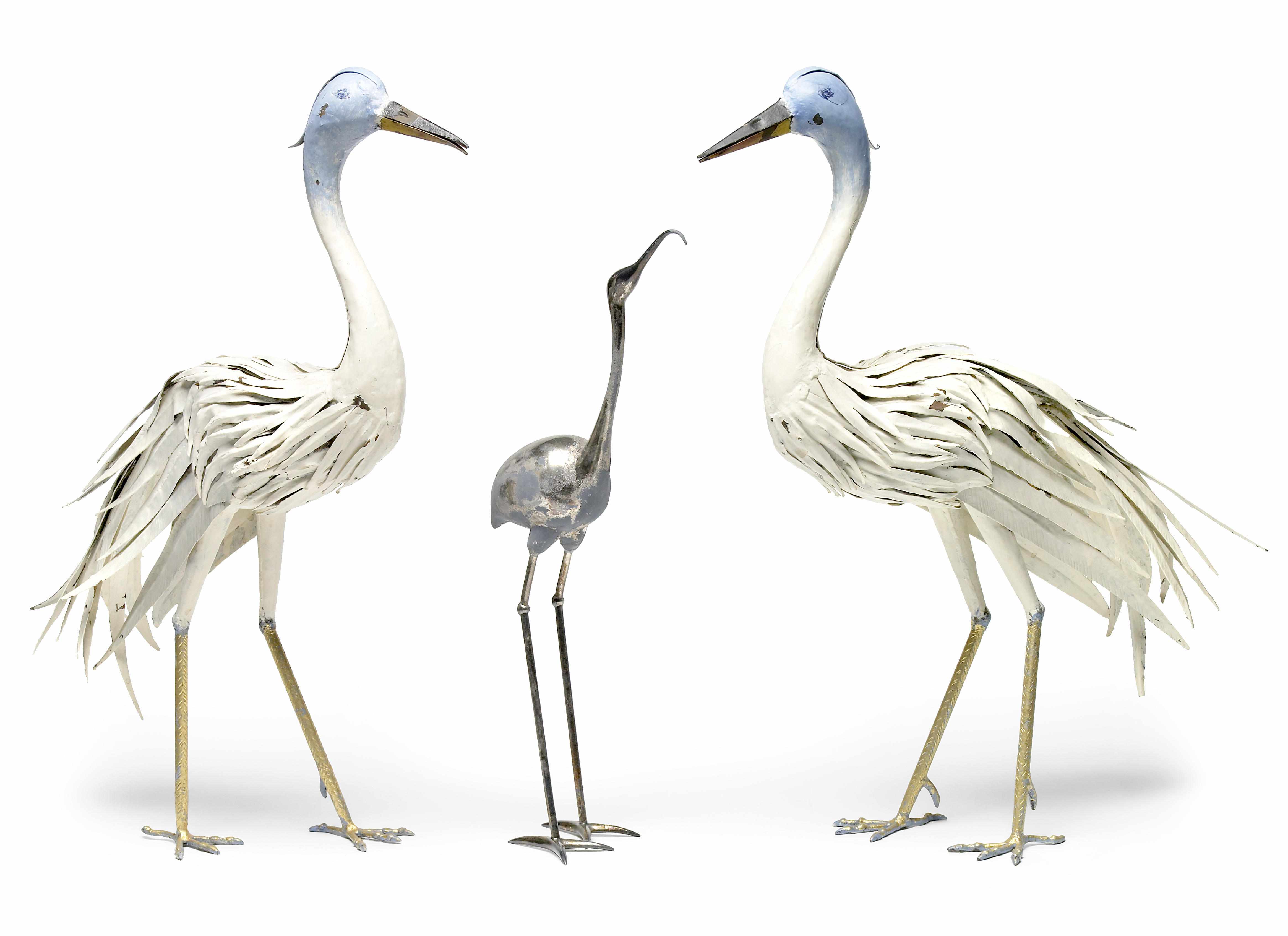 Appraisal: A pair of paint decorated tle models of storks th