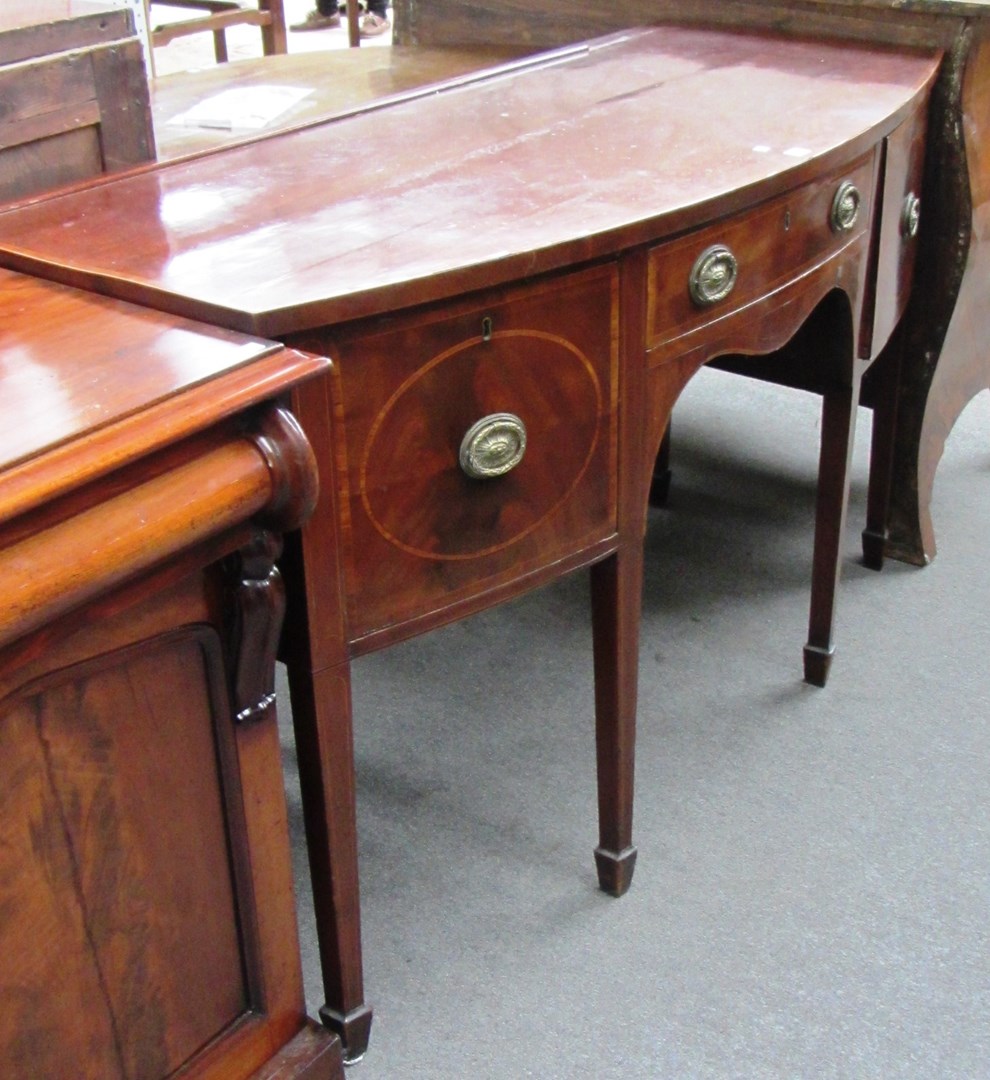 Appraisal: A George III inlaid mahogany bowfront sideboard with three frieze