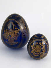 Appraisal: Two dark blue glass Easter eggs each wheel engraved and