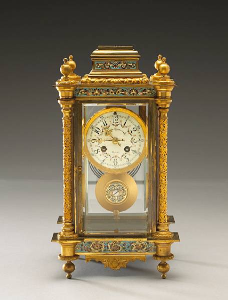 Appraisal: A French gilt brass and champlev enamel four glass regulator