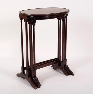 Appraisal: A nest of three oval tables on spindle turned supports