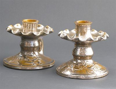 Appraisal: A pair of Sunflower Pottery Platinum Crackled glaze candlesticks by