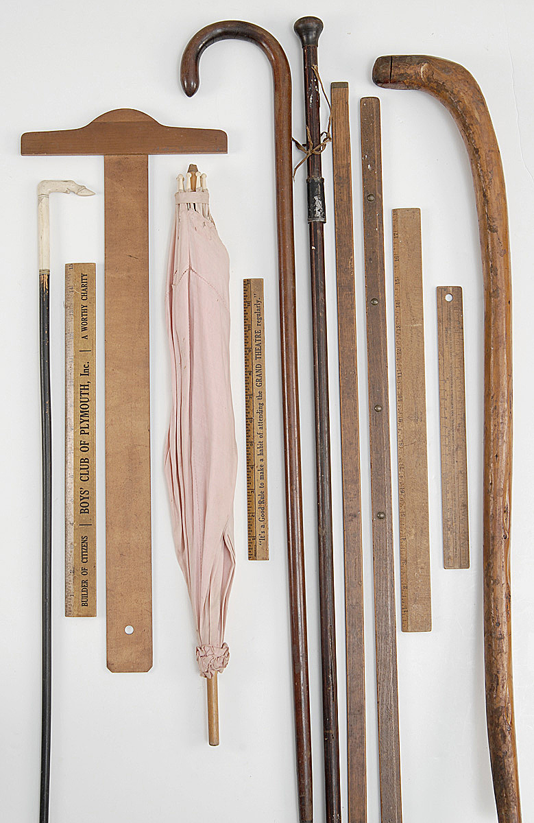 Appraisal: TEN ASSORTED RULERS AND CANES together with a parasol and