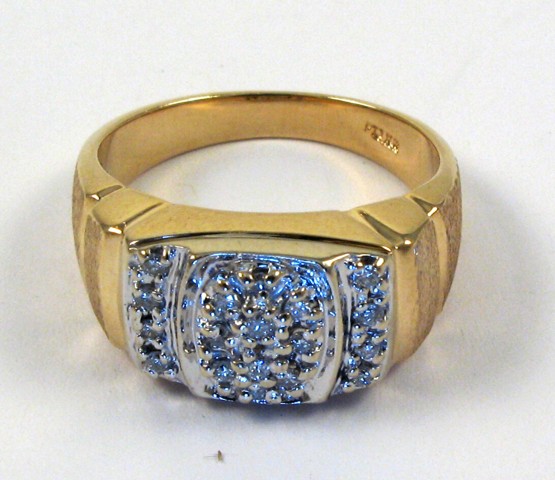 Appraisal: MAN'S DIAMOND AND TEN KARAT GOLD RING The top half