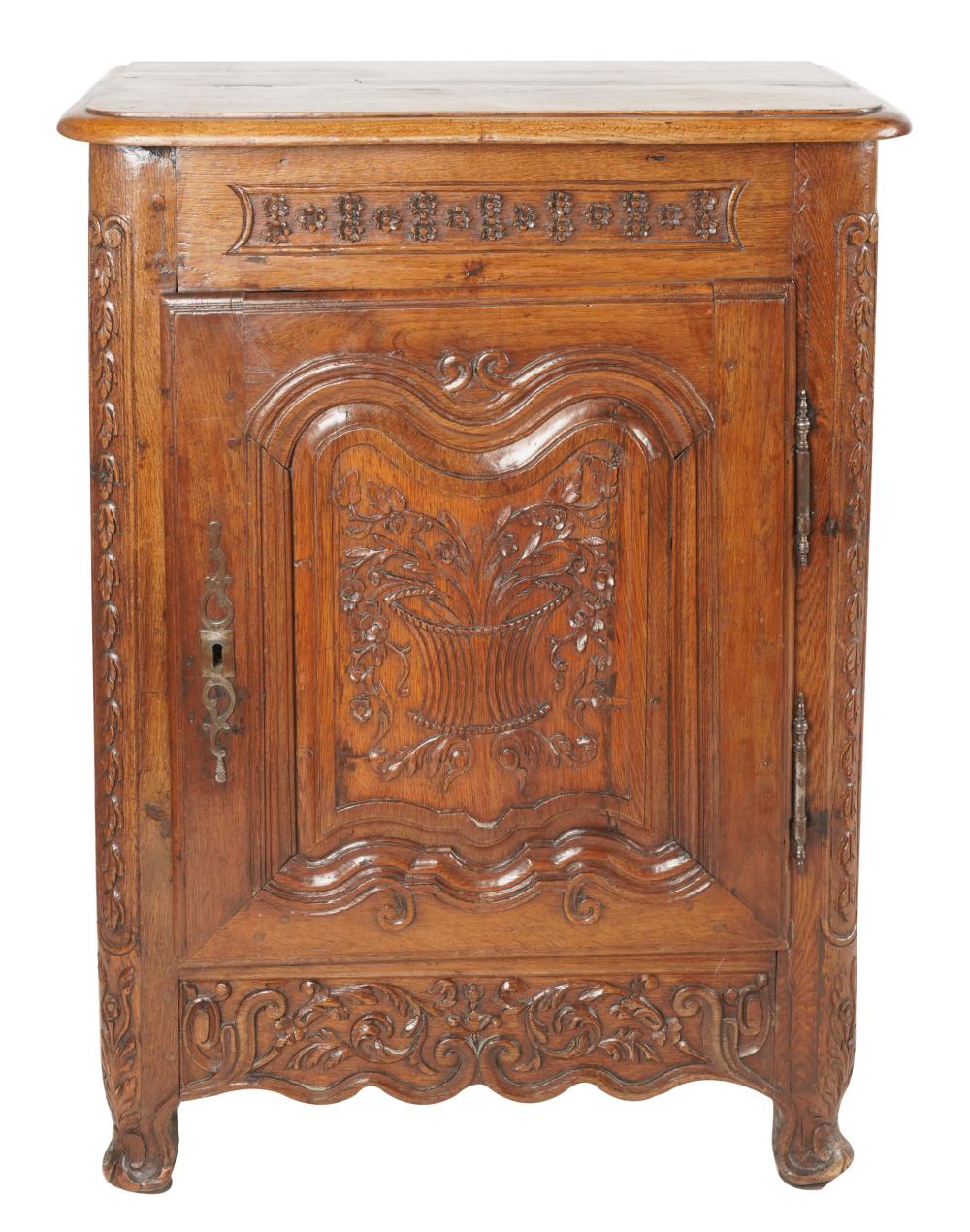 Appraisal: LOUIS XV PROVINCIAL-STYLE CARVED FRUITWOOD CABINEThaving one paneled door enclosing