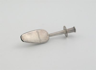 Appraisal: A Victorian medicine or castor oil spoon with a tubular