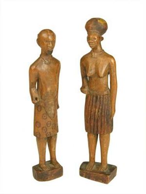 Appraisal: A pair of South African carved wood standing figures of