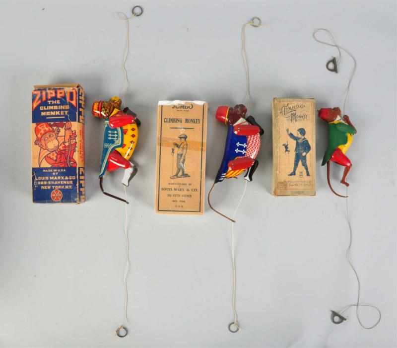 Appraisal: Lot of Tin Litho Monkey Toys Includes Marx Zippo Marx