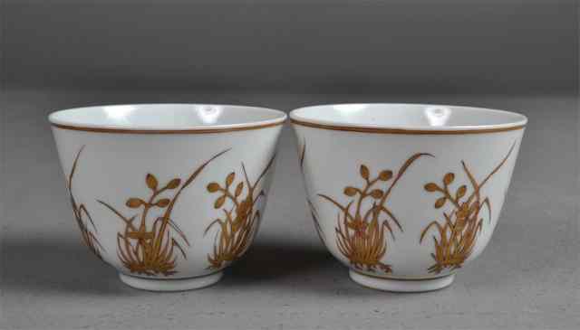 Appraisal: Pair Chinese White and Golden Orchid CupsPair of white porcelain