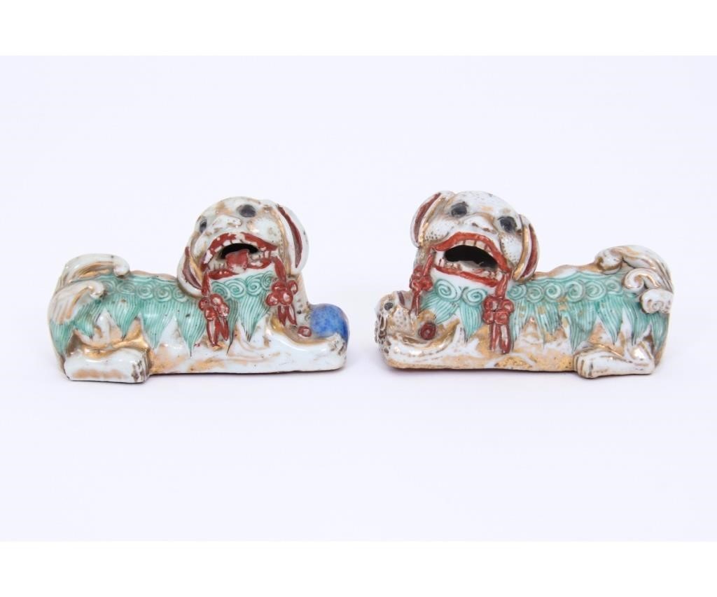 Appraisal: Pair of Chinese porcelain recumbent Foo dogs probably th c