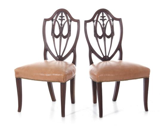 Appraisal: Pair Georgian mahogany shieldback leather side chairs th century arched