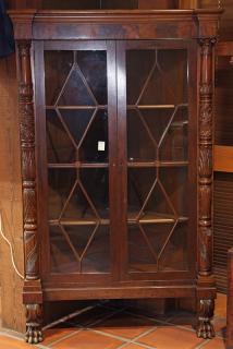 Appraisal: Empire Revival mahogany corner cabinet the two door mullioned case